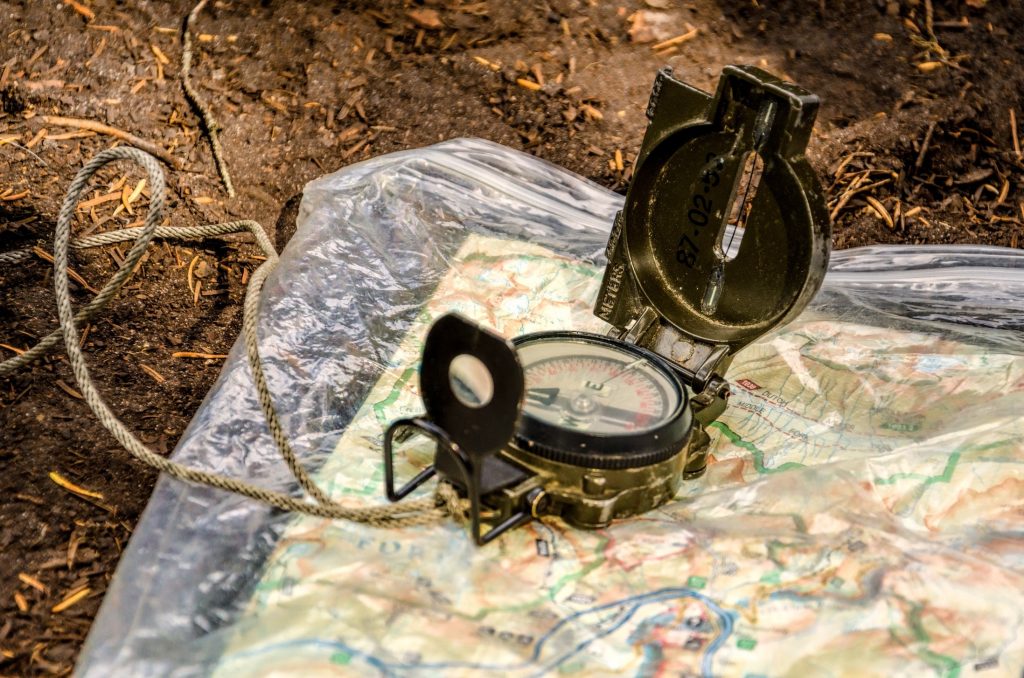 Map and compass to navigate hike