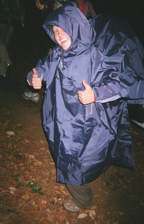 22 Rookie Mistakes New Backpackers Make and How To Avoid Them 2 Woman with backpacking poncho.