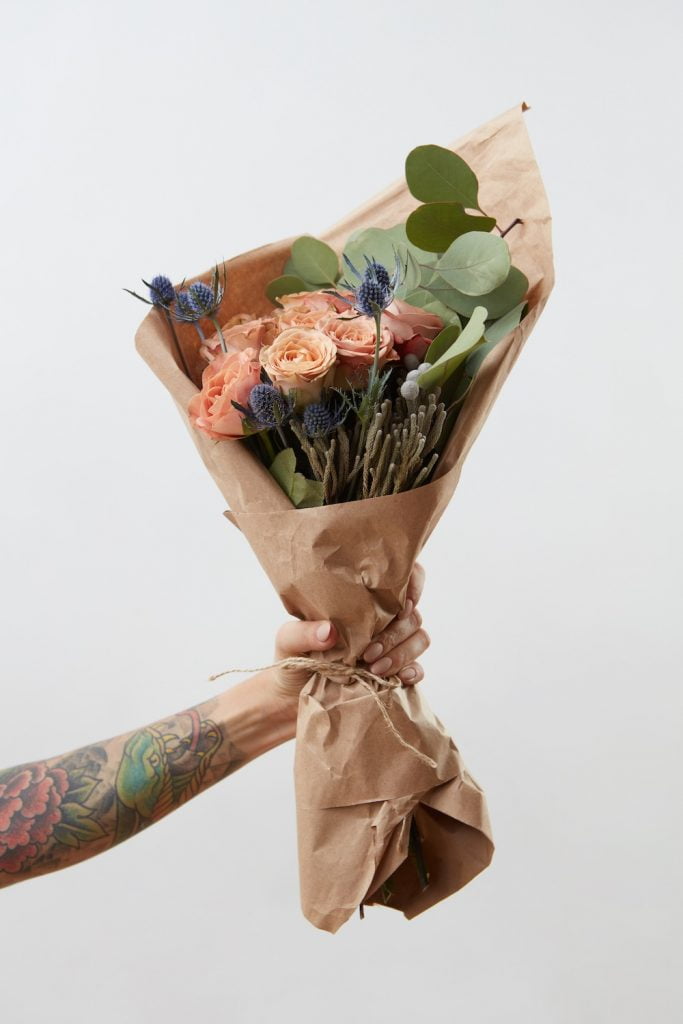 Eco Friendly Gift Ideas for Mother's Day 1 Eco Friendly Gift Ideas for Mother's Day | tattooed hand holding flowers for Mother's Day