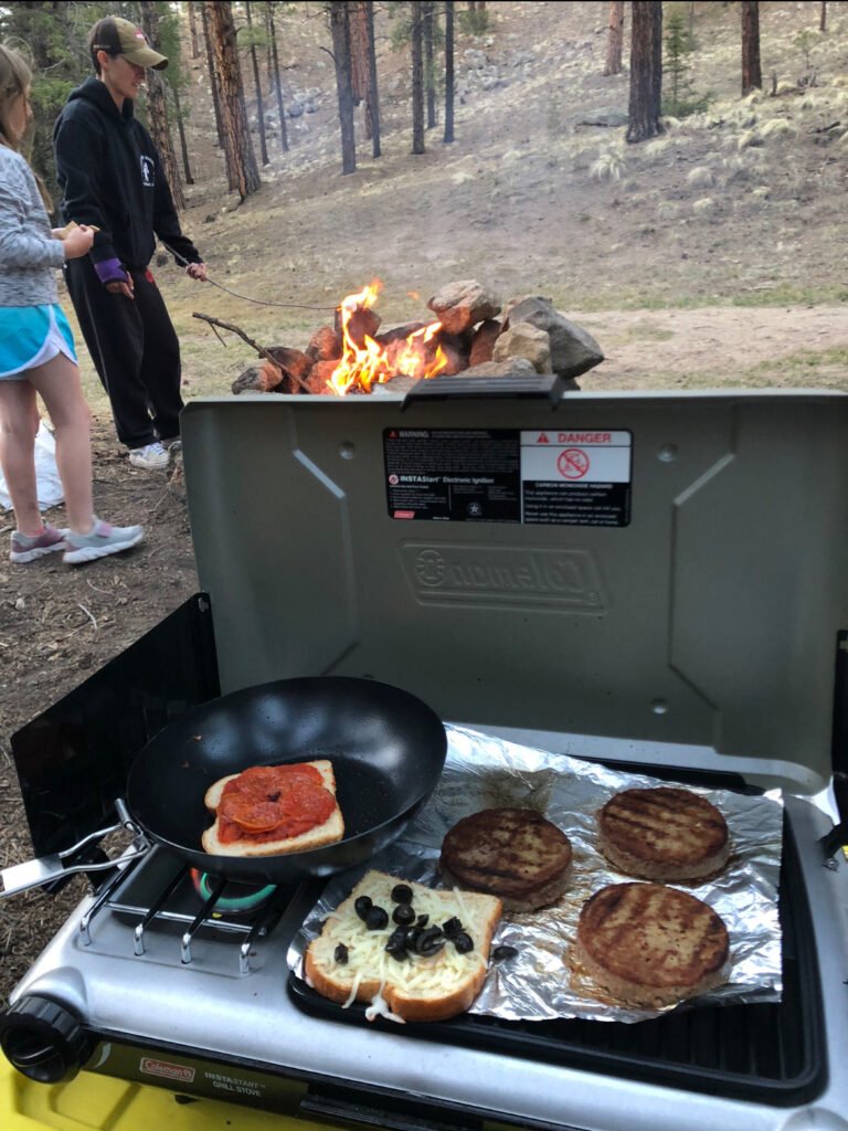 13 Things That Can Go Wrong While Camping… and How to Deal with Them 2 A campfire in a wooded area.