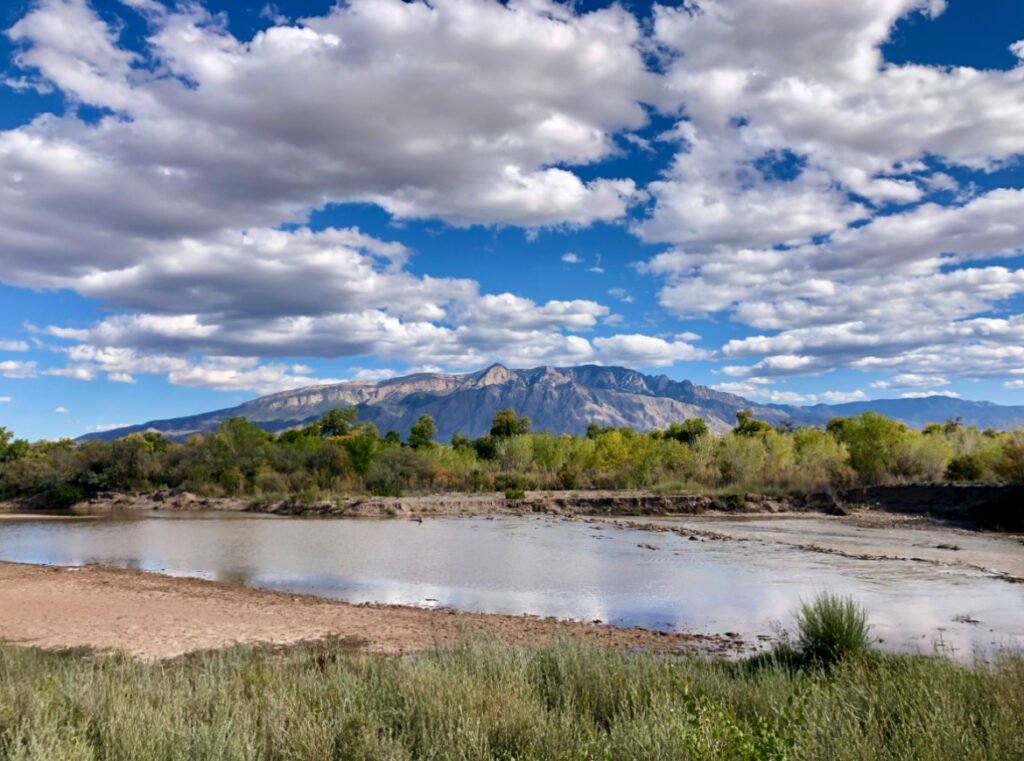 Solo Camping As A Woman: My Safety Tips & Advice When Camping Alone! 4 A river with mountains in the background.